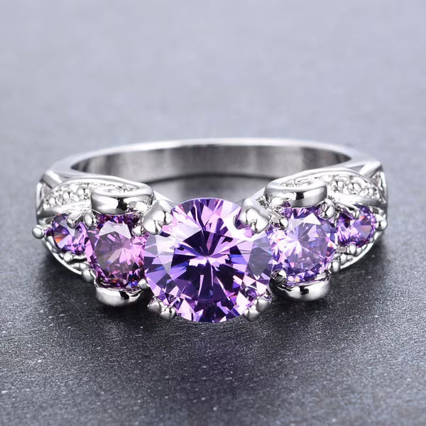 Zilverkleurige vintage ring met amethistpaarse steentjes