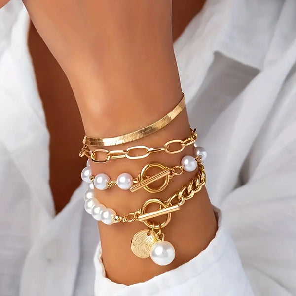Chique goudkleurige 4-delige armbandenset - slang, parels & schakels | goudkleurig