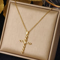Kristallen gedraaide kruisketting | goudkleurig