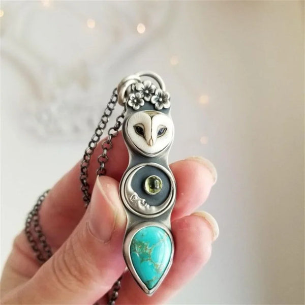 Turquoise ketting met staafhanger en wijze uil