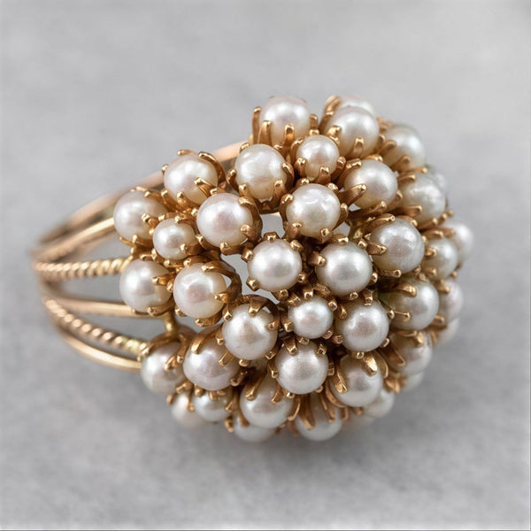 Elegante goudkleurige ring met ingelegde parels