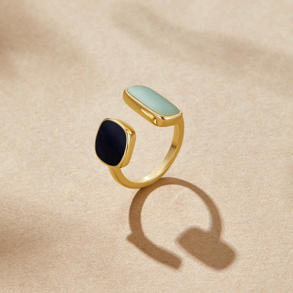 Goudkleurige open ring met twee stenen