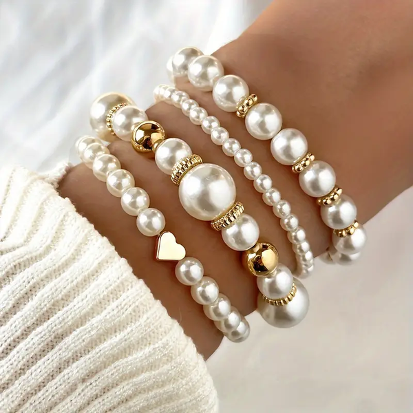 Goudkleurige armbandenset met parels en kraaltjes