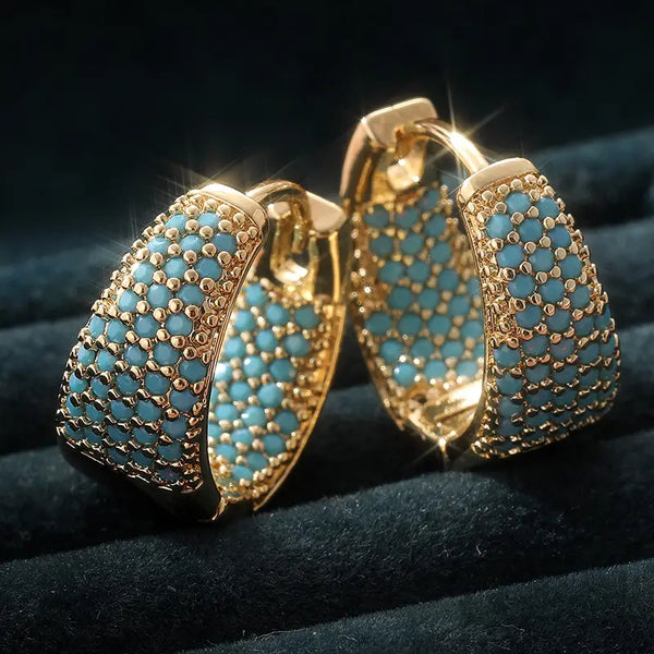 Goudkleurige oorringen met turquoise kraaltjes | goudkleurig