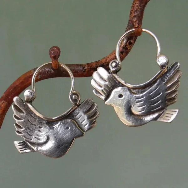Boho hangoorbellen met vogelmotief – zilverkleurig