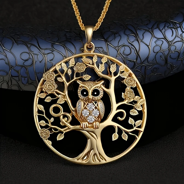 Ketting met goudkleurige uil en levensboom