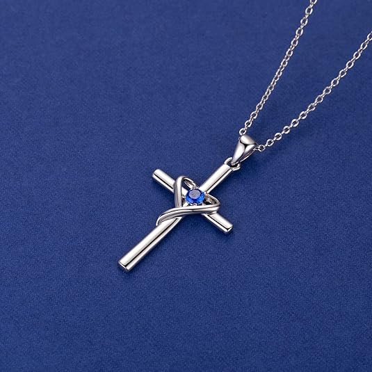 Kruisketting met saffierblauw steentje | witgoudkleurig