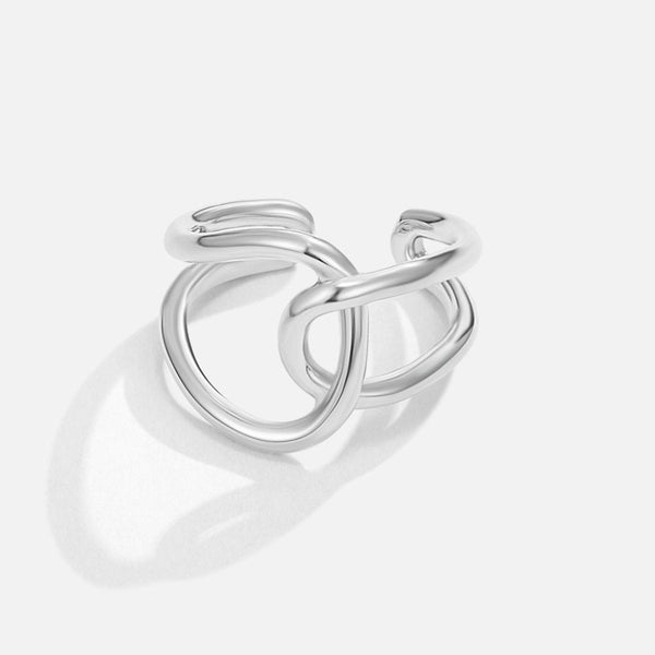 Zilverkleurige open ring met verstrengelde lussen