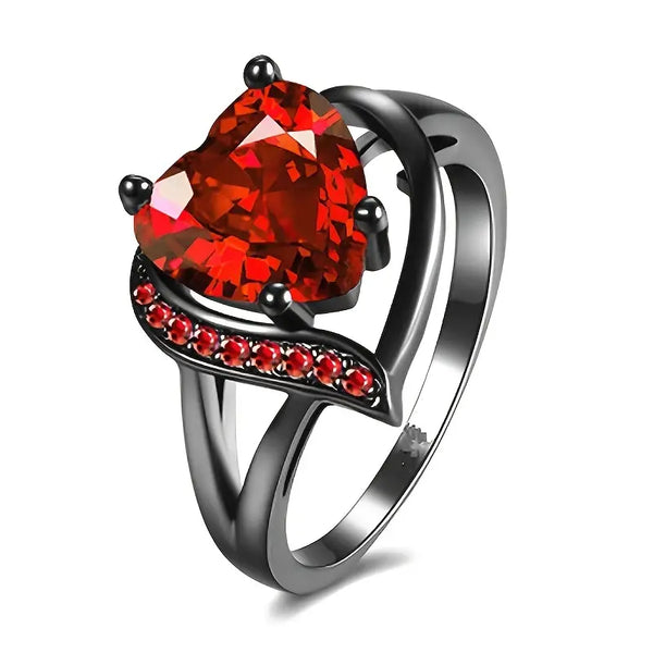Zilverkleurige hartring met robijnrode steen