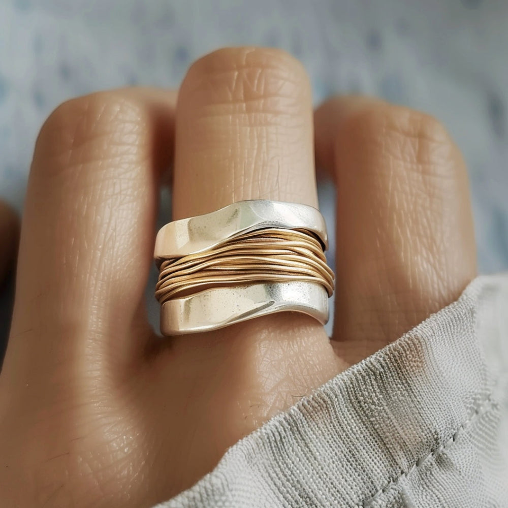 Gewikkelde ring in zilver- en goudkleur