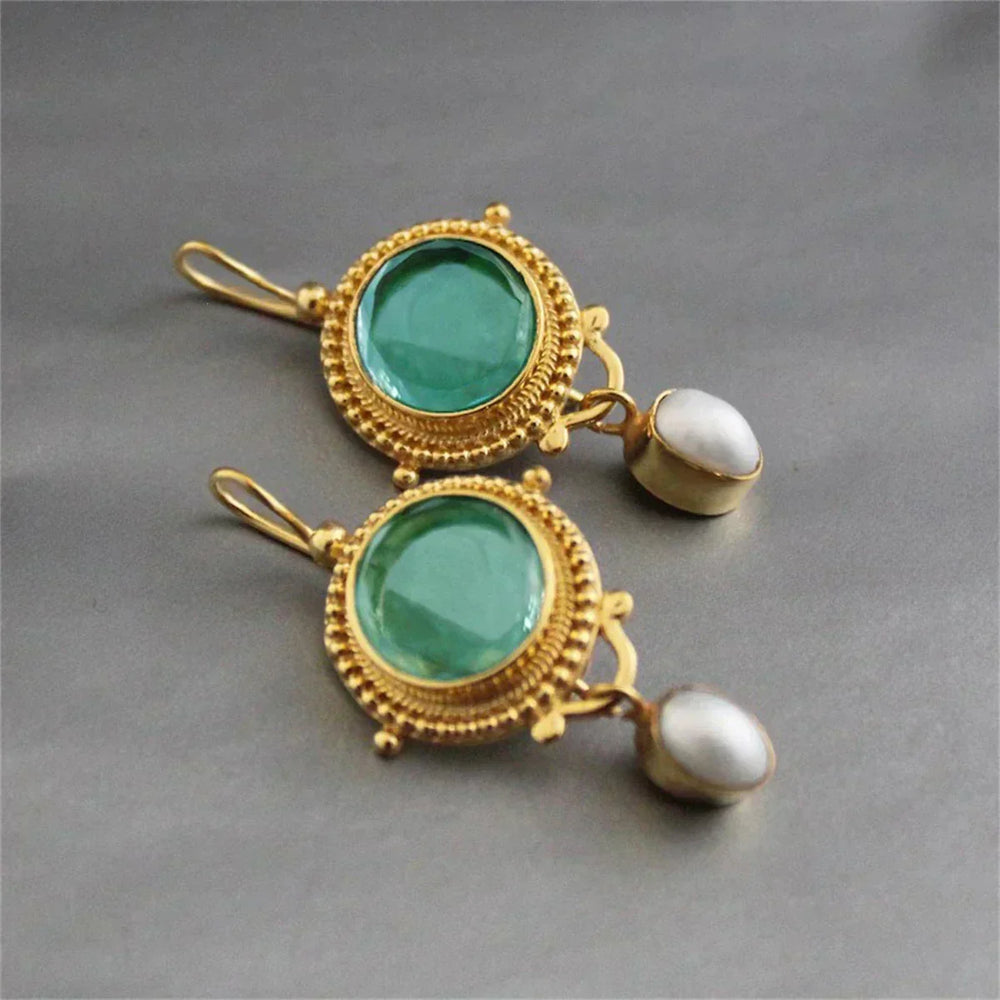 Dierbare oorbellen met turquoise steen