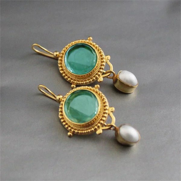 Dierbare oorbellen met turquoise steen