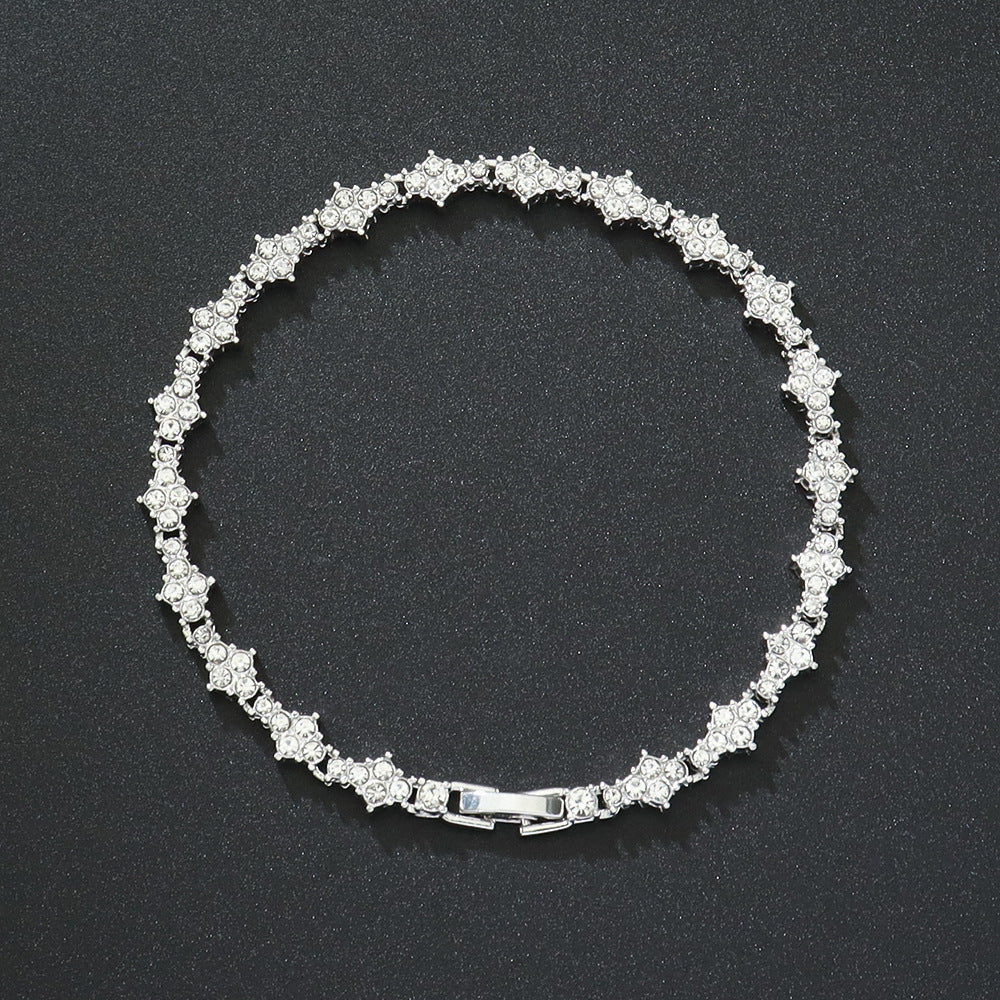 Klassieke tennisarmband met clusters | witgoudkleurig