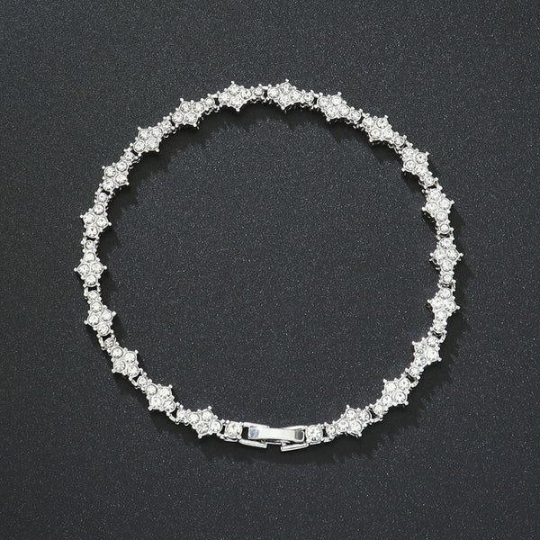 Klassieke tennisarmband met clusters | witgoudkleurig
