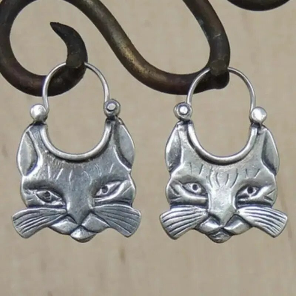 Vintage zilverkleurige oorbellen met kattensnorharen